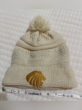 Cream Knit Pom Beanie with Gold Lion Patch
